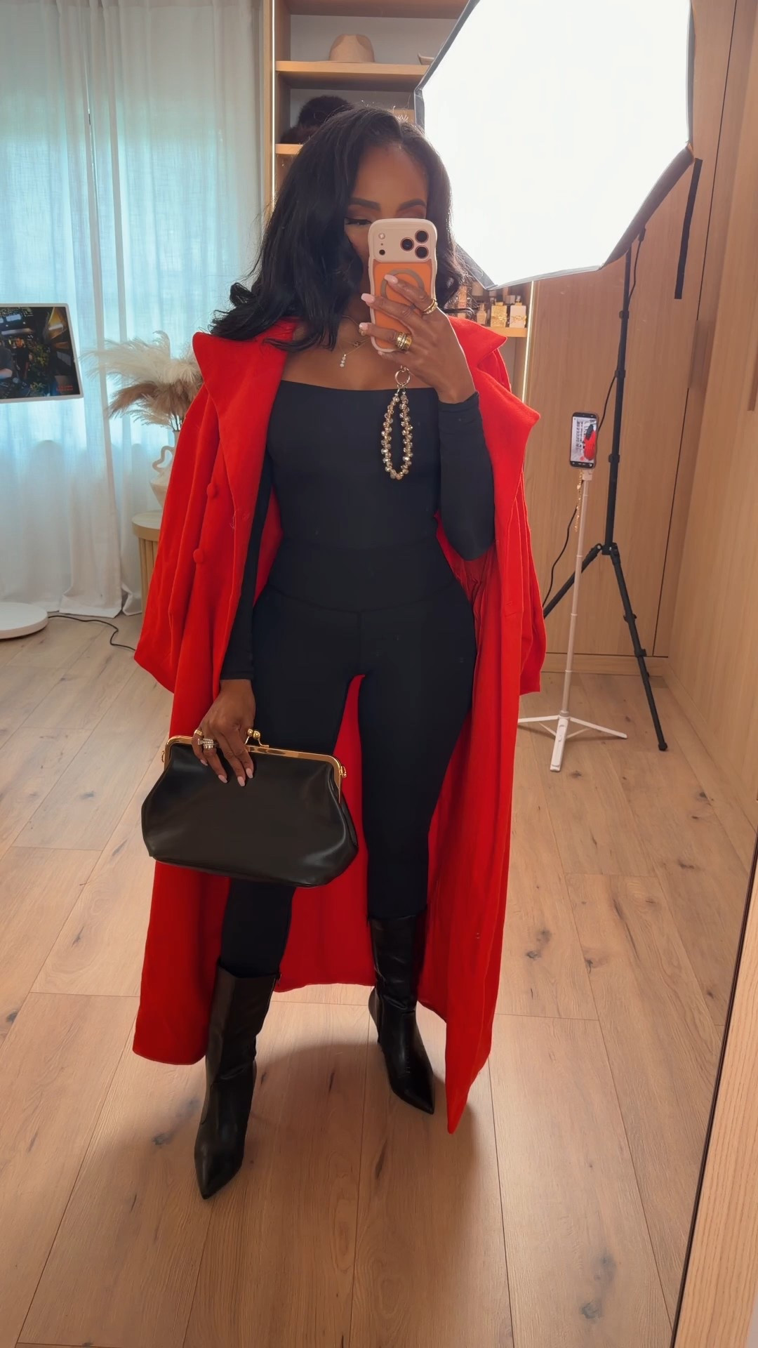 Bold winter energy — an all-black base layered with this striking red coat for a luxe, high-impact cold-weather look. Sleek, warm, and effortlessly elevated. Tap to get details.

Perfect for dinner nights, holiday events, and anytime you want a dramatic winter moment.

📏 Sizing:  
Height: 5'4  
Weight: 138 lbs  
Bust: 34D  
Waist: 27"  
Hips: 40"  
Top: Small  
Leggings: Small  

A timeless combo of structured layers, rich textures, and clean lines that makes winter dressing feel powerful and polished.

Keywords: chic winter outfit, red wool coat look, black slimming base layers, holiday fashion inspo, elevated cold weather style, winter night out outfit, sleek layering ideas

Follow me on Instagram and YouTube @kirasfashionfinds