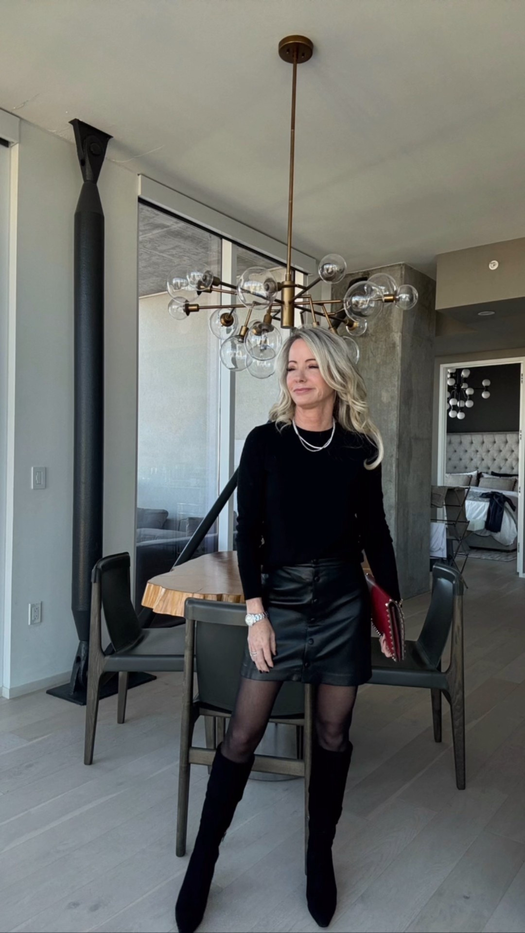 A chic and simple holiday outfit ✨
If you love all-black looks, this one is so good. The leather mini, boots, and red clutch make it perfect for dinners, parties, or date night. Shop the pieces below.

#LTKHoliday #LTKOver40 #LTKStyleTip