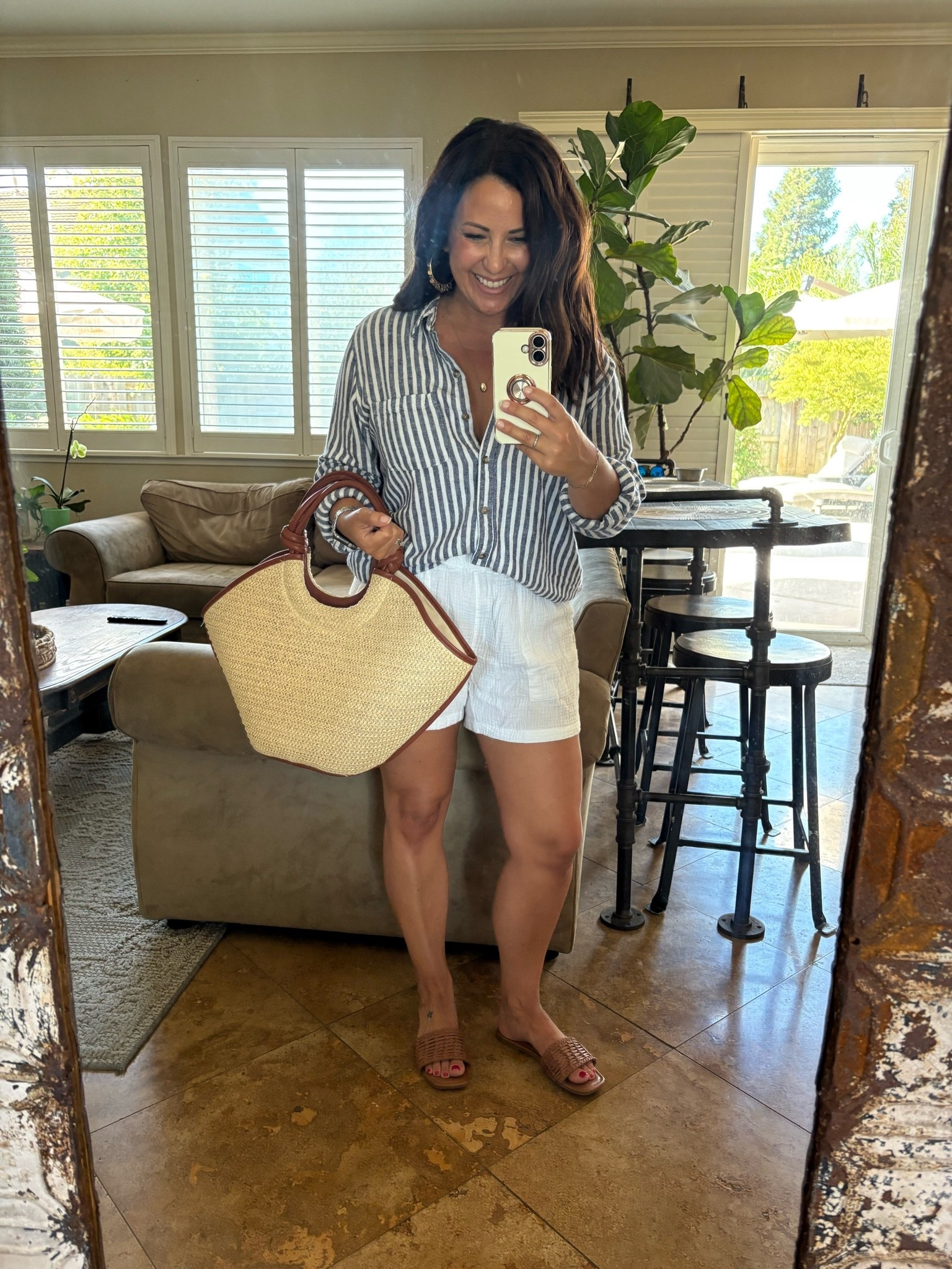 Wine country casual 🍷

A lightweight striped button-down, gauze shorts, woven slides, and a straw tote is one of my favorite summer outfit formulas. Comfortable enough for a farmers market, polished enough for a winery, and easy to mix and match all season long.

I’ve linked my outfit plus similar pieces to recreate the look.
#LTKStyle #SummerOutfit #PetiteStyle #CasualChic #Over40Style

#LTKOver40 #LTKPetite #LTKmomlife
