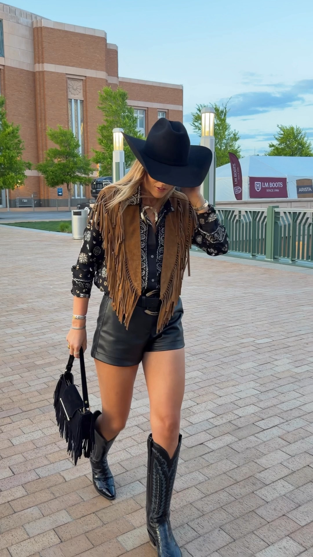 shorts in a small, shirt in a size 4, patent cowboy boots are true to size, purse is old but i linked similar, hat is an american 40x, neck cuff is from november maker 

#LTKTall #LTKFestival #LTKootd