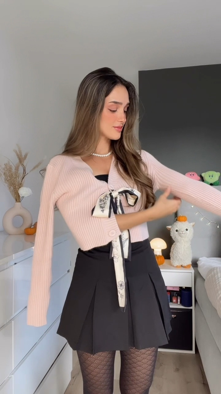 CARDIGAN STYLE HACK FOR FALL🧸🎀

Crop pink ribbed knit cardigan • Thin black and white scarf with flower pattern bow ribbon • black autumn pleated skirt • pattern tights • black tube top

#LTKstyletip #FashionMonth #LTKautumn