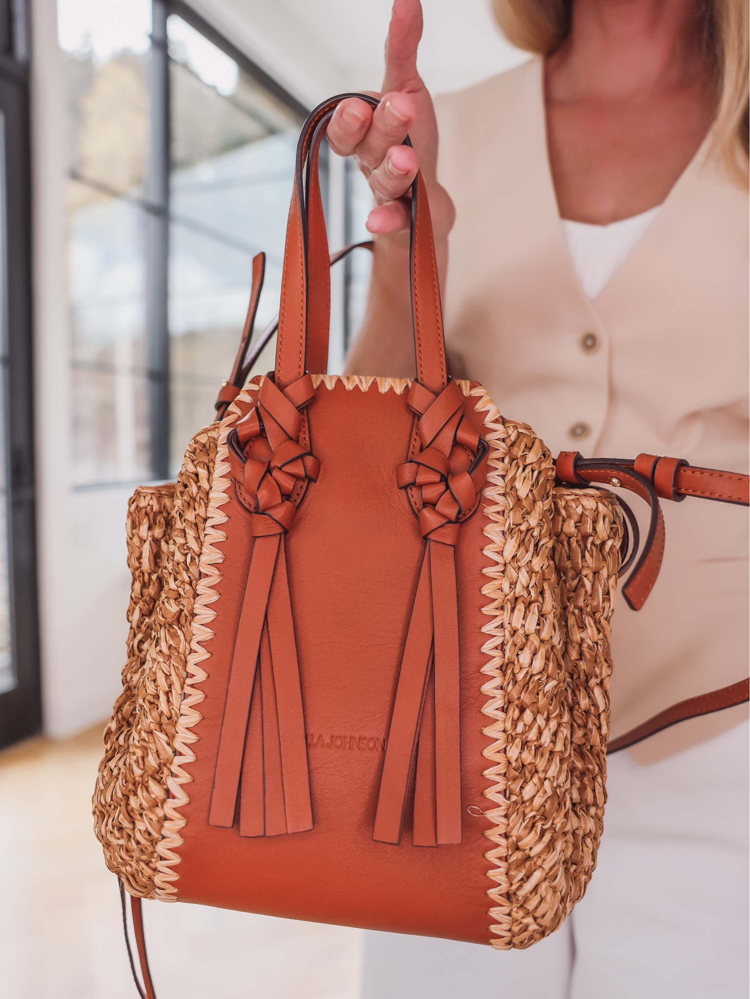 I love this beautiful Ulla Johnson raffia bag! The brown leather is really high-quality and luxe-looking but combining it with the woven raffia makes it feel more casual and summer-like. The shape is unique and fun, I love the drawstring closure, and it has an adjustable strap. You’ll use this bag for many more springs and summers to come!

~Erin xo 

#LTKSeasonal #LTKstyletip #LTKitbag