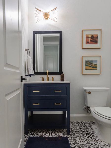 Bathroom vanity I love in my parent’s powder bathroom. The navy color is so pretty and I appreciate the drawers for storage. We added brass hardware in powder bath and complemented the navy color palette. Linking vanity and bathroom accessories  

#LTKstyletip #LTKhome