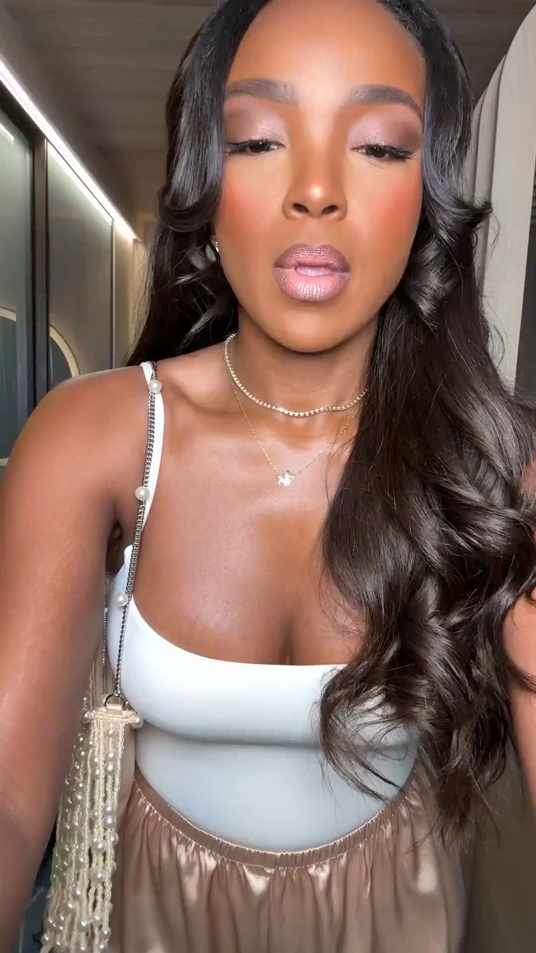 Hi Babes! 

This neutral satin look is giving soft luxury in the best way ✨ The silky champagne trousers paired with the fitted square-neck top make this outfit feel so elevated while still being effortless and comfortable. I love how simple pieces in rich textures instantly make an outfit look expensive.

These are the kinds of staples I always recommend investing in because you can style them so many different ways — heels for dinner, sandals for vacation, or even a blazer layered over for a more polished vibe. Definitely one of those high cost-per-wear outfits you’ll keep recreating.

Perfect for:
• Dinner dates  
• Vacation nights  
• Resort dinners  
• Summer evenings  
• Girls night looks  
• Elevated casual outfits  

Everything is linked below ✨

xx Kira | IG: KirasFashionFinds

34D - 27 - 40 • Size Small or 4