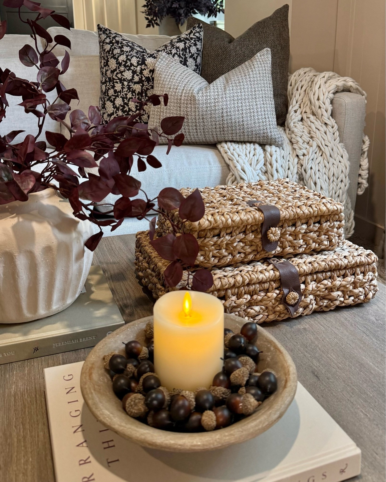 Cozy Fall Coffee Table Styling 🍂

A few simple layers are all it takes to bring that warm fall feeling into the living room. Rich burgundy stems, woven textures, cozy pillows, a chunky knit throw, and the prettiest little acorn filler around a flickering candle make this space feel ready for the season.

I love mixing everyday pieces with subtle fall touches for a look that feels cozy, collected, and easy to recreate.

#FallDecor #FallHome #CoffeeTableStyling #FallDecorating #CozyHome #AutumnDecor #HomeDecor #FallInspiration

#LTKSeasonal #LTKSaleAlert #LTKHome