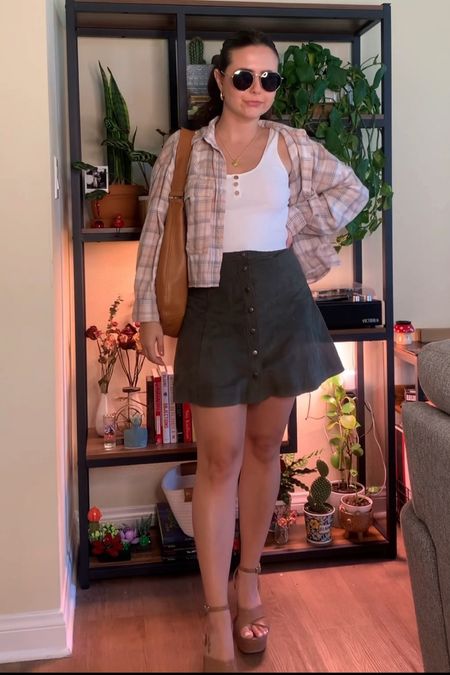 day 21 of transitional outfits for fall 🫶🏼 

heels: linked, on clearance for $30! |
skirt: abercrombie no longer avail, linked similar |
top: American eagle no longer avail, linked similar |
flannel: abercrombie no longer avail, linked similar |
purse: madewell no longer available, linked similar |
jewelry: linked |
sunnies: linked, code CHRISTINEH10

#LTKSeasonal #LTKfindsunder100 #LTKstyletip