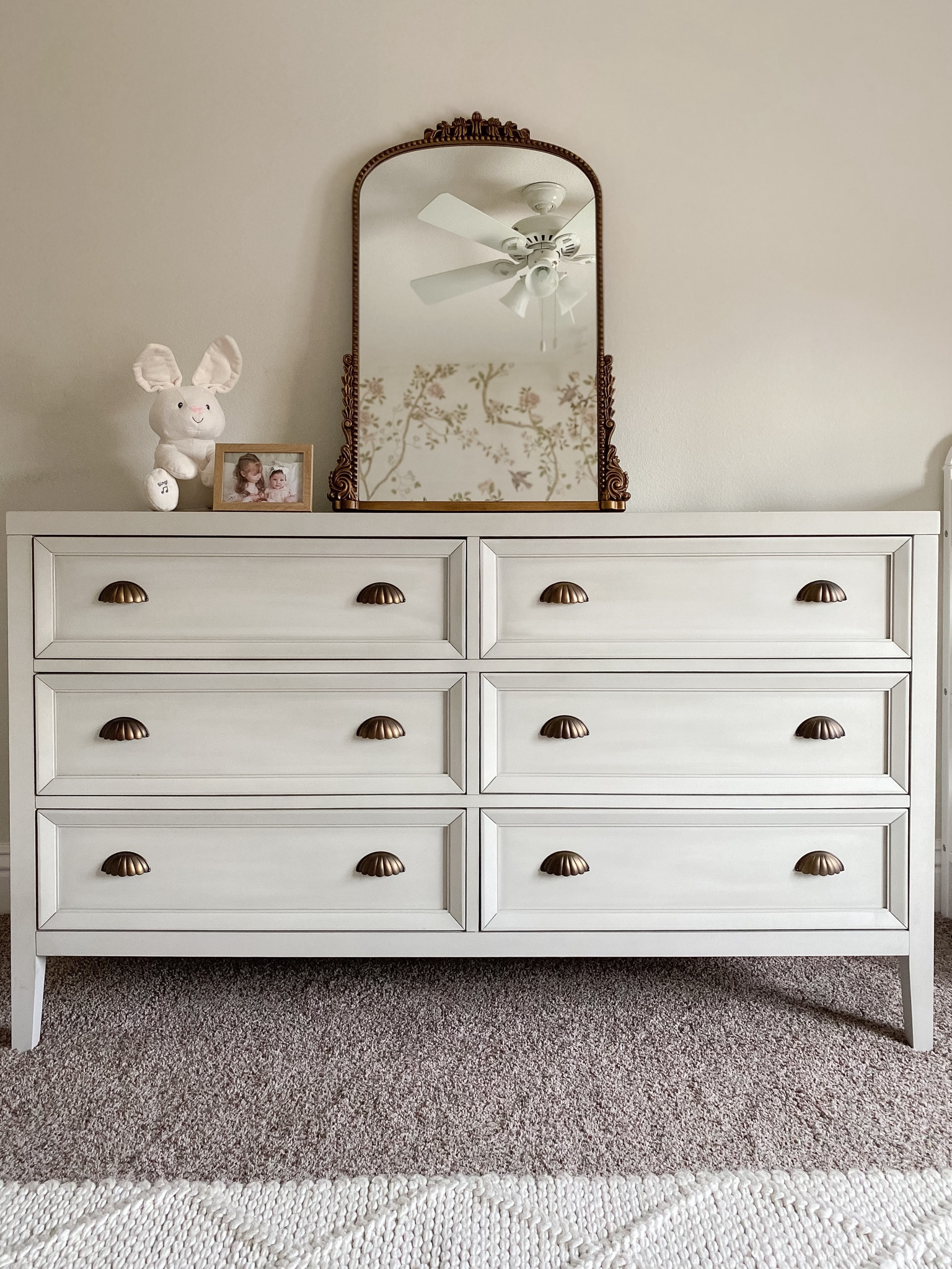 Nursery inspo: vintage inspired dresser, anthro mirror dupe, soft neutral cream rug  

#LTKbaby #LTKfamily #LTKhome