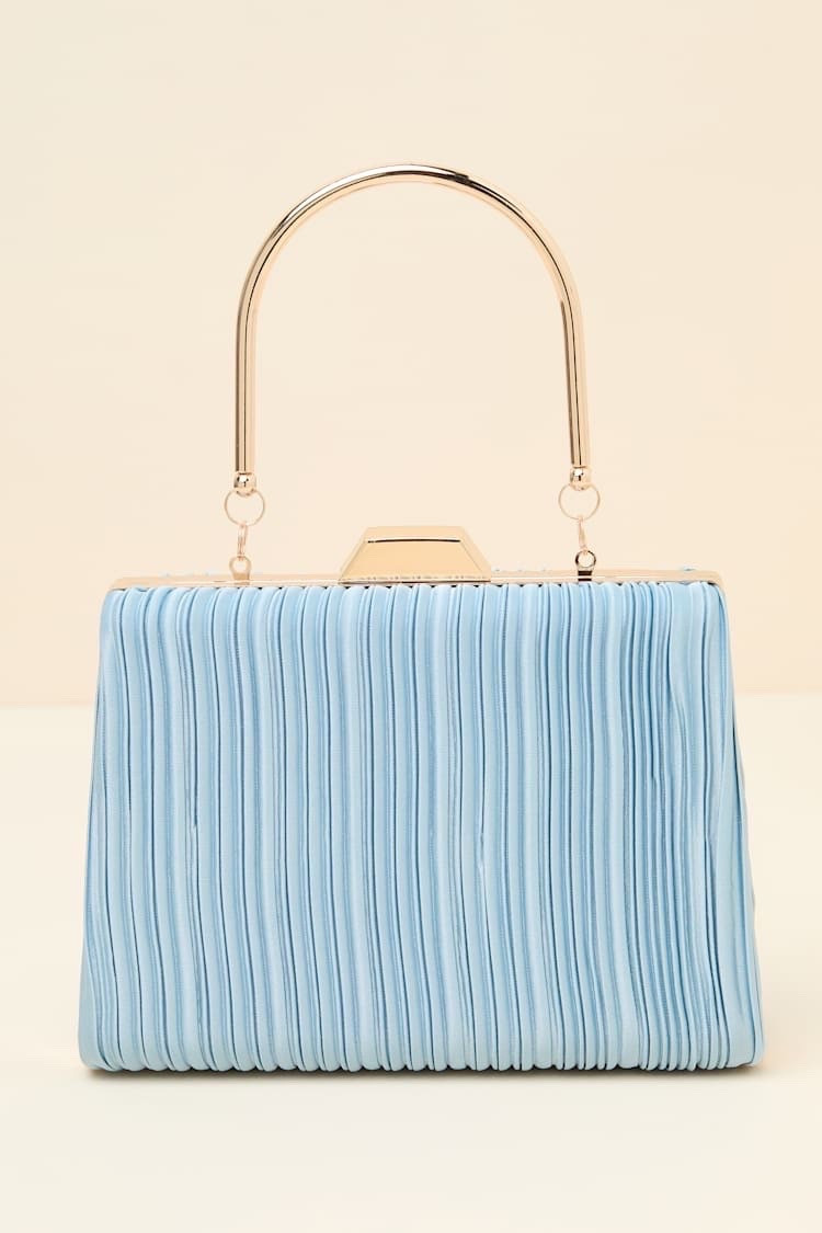 The Ezra Light Blue Pleated Crossbody Clutch adds a soft, feminine touch to occasion dressing with its delicate light blue hue and elegant pleated texture. A versatile accessory for weddings, bridal events, date nights, vacations, and summer celebrations. Under $40.

Ideas:

* light blue clutch
* pleated handbag
* wedding guest accessories
* summer accessories
* feminine style

Keywords:

* light blue clutch
* blue clutch
* pleated clutch
* crossbody clutch
* crossbody bag
* wedding guest accessories
* bridal accessories
* wedding bag
* evening bag
* date night accessories
* special occasion accessories
* vacation accessories
* summer handbag
* statement clutch
* women’s handbags

#LTKootd #LTKgrwm #LTKTravel