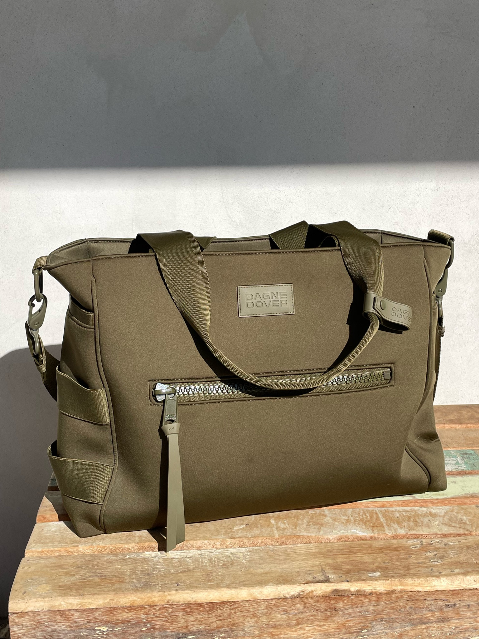 The materiel, color and size makes the perfect diaper bag 