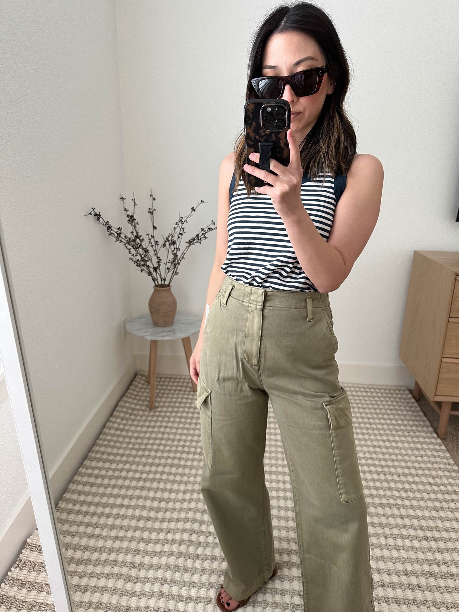 Gap petite cargo pants. These are super comfortable, have a true high rise and work length wise. Really love these! I think a wash and dry will shrink them just a bit to be a little more flattering. 

Tank - Madewell small. Need my true size, xs
Pants - Gap petite 00
Sandals -Hermes 35
Sunglasses - Celine

Petite Style, Neutral outfit, capsule wardrobe, minimal style, street style outfits, Gap Try-On’s, Gap petite, Affordable fashion, Spring fashion, Spring outfit, cargo pants

#LTKstyletip #LTKFind #LTKunder100
