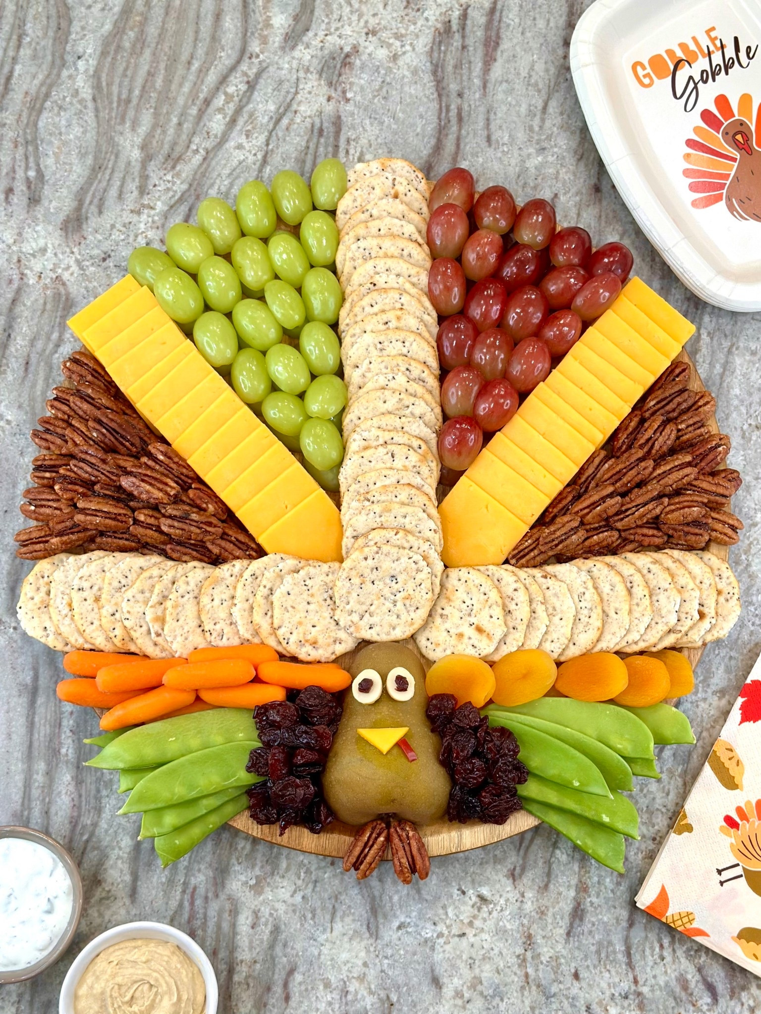 How cute is this Turkey Snack Board?! This cheese board features vegetables, fruits, nuts, and crackers for has the perfect balance of snacks to keep everyone happy until the feast is ready.

#LTKParties #LTKHome #LTKSeasonal