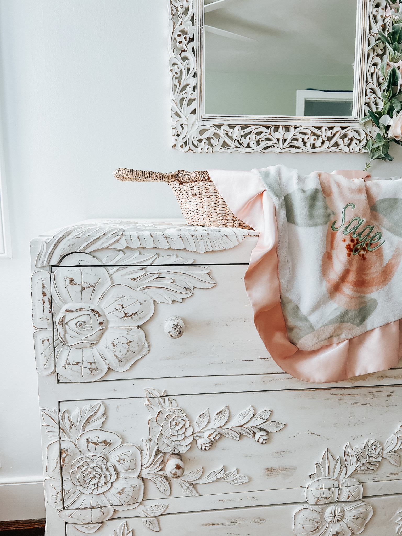 Baby girl room with carved wood dresser and mirror.

Boho girl room / Anthropologie enchantment dresser / world market mirror / wicker changing basket 

#LTKhome #LTKbaby #LTKbump