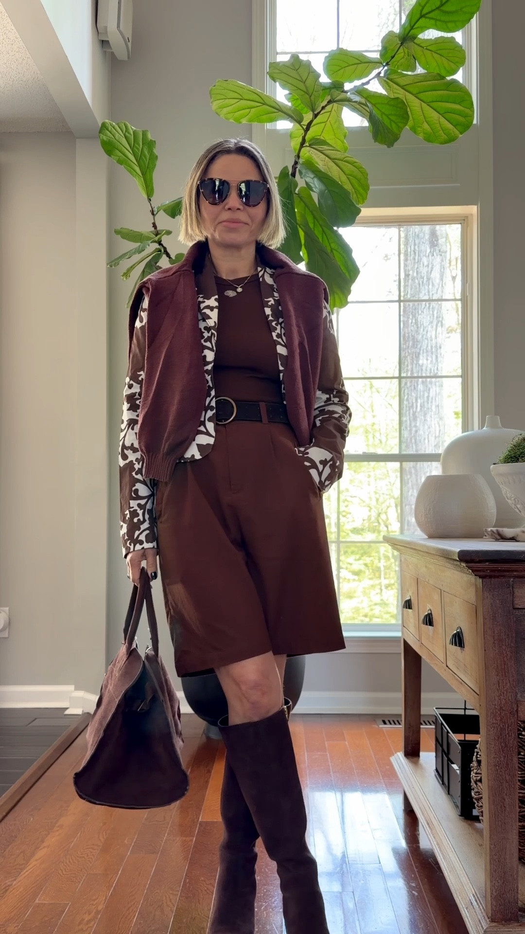 spring outfits 2026
Chocolate brown sleeveless top paired with linen bermuda, knee high boots , paisley brown cropped jacket, added a brown pullover sweater because layers are a necessity during early spring. Also added a chocolate brown suede bag and sunnies!🤎🤍

#spring #office #casual #outfit #easter 

#LTKOver40 #LTKSeasonal #LTKgrwm