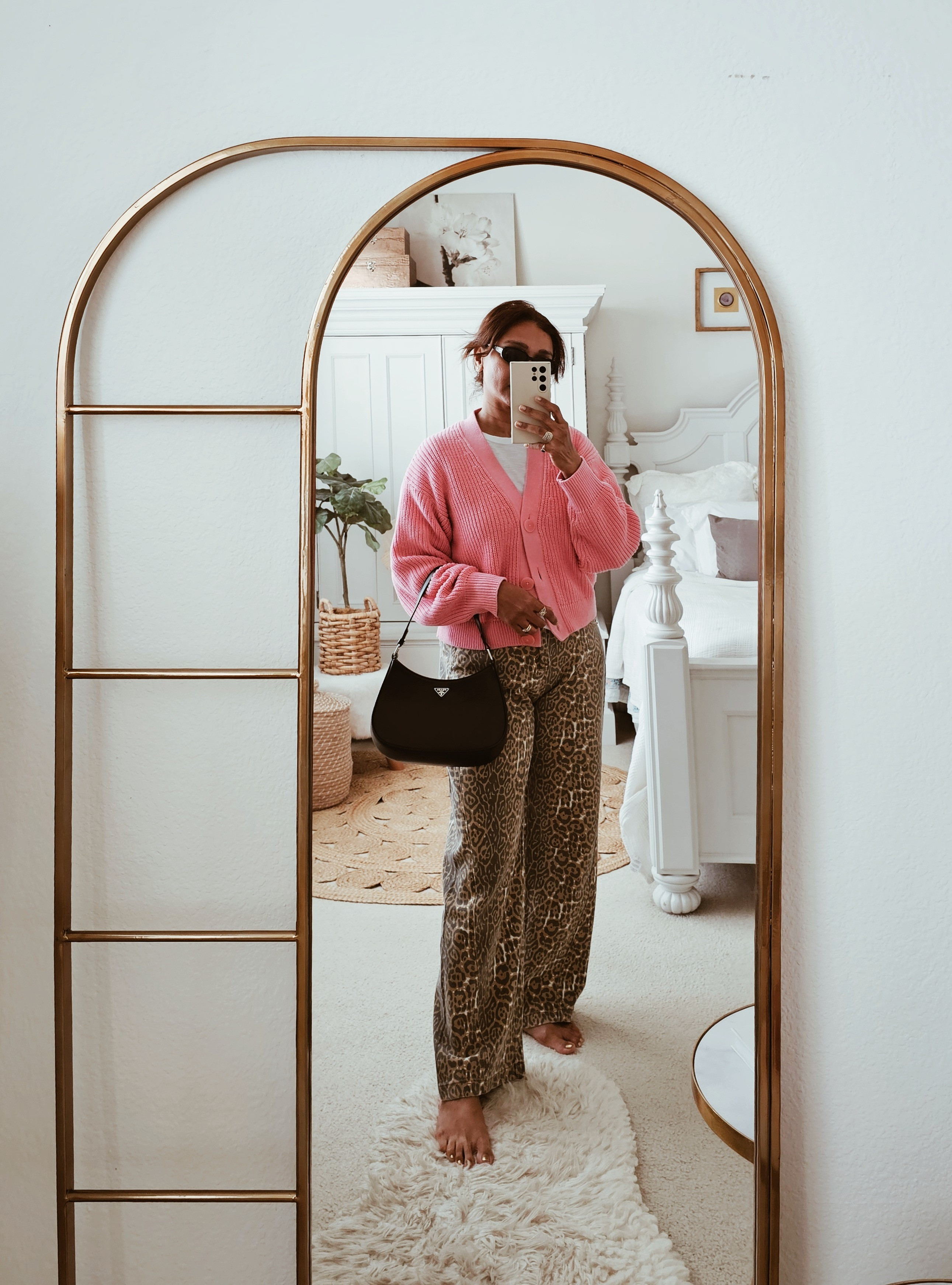 Pink knit cardigan outfit with leopard wide leg pants. Elevated casual look styled with Prada shoulder bag and black sunglasses.pink cardigan outfit ,  leopard pants outfit, chic everyday look ,designer shoulder bag, European ,street style

#LTKSpringSale #LTKootd #LTKBeauty