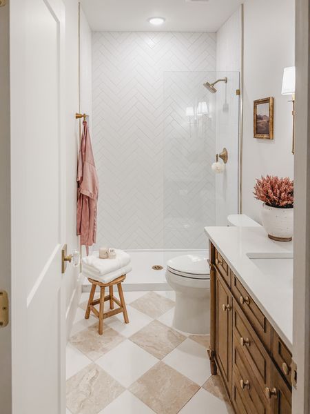 Guest bathroom with warm wood and pops of pink! With this bathroom being in the basement it was important keep it light and bright due to the lack of natural light

Home design, guest bathroom, bathroom refresh, style inspo, light and bright, pops of pink for the fall, creamy whites, warm wood tones, neutral home, gold detail, home refresh, bathroom info, guest bath finds, wooden stool, crystal door knob, Wayfair, Michaels, Amazon, Target, Home Depot, At Home, aesthetic home, faux florals, vanity finds, gold fixture, shower glass panel, pink robe, home decor, bath detail, shop the look!

#LTKstyletip #LTKSeasonal #LTKhome