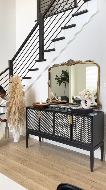 Shop my beautiful entry way decor😻 Black and white modern credenza/ sideboard with antique gold arched mirror and accents 💕

#LTKFind #LTKU #LTKhome