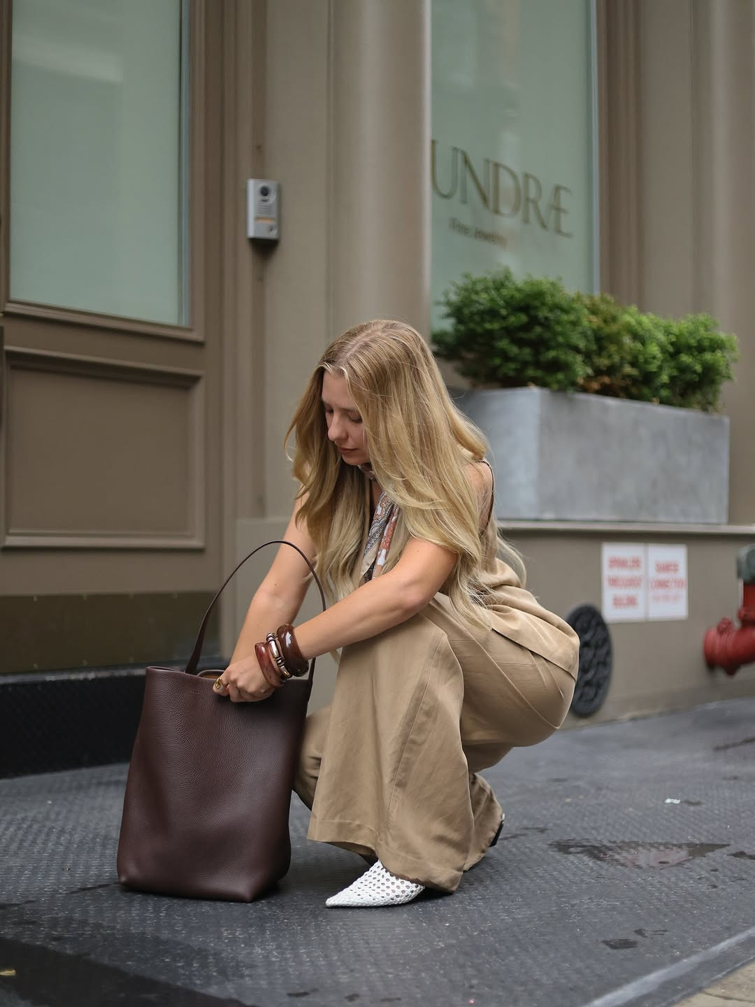 City-ready sophistication. This elevated look features a tan tailored vest, matching wide-leg trousers, and woven white pointed-toe mules, finished with a chocolate leather tote and silk neck scarf. #CityStyle #WorkwearInspo #LTKcity 

 #LTKdayinmylife #LTKgrwm #LTKootd