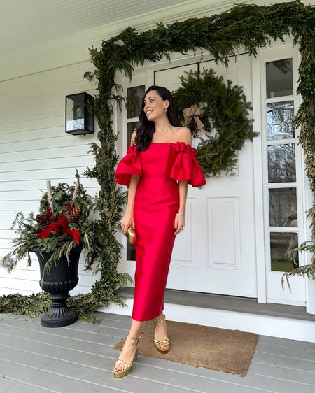 Kat Jamieson wears a red cocktail dress. Holiday outfit, wedding guest dress, formal, red dress, gold heels. 

#LTKHoliday #LTKwedding #LTKparties
