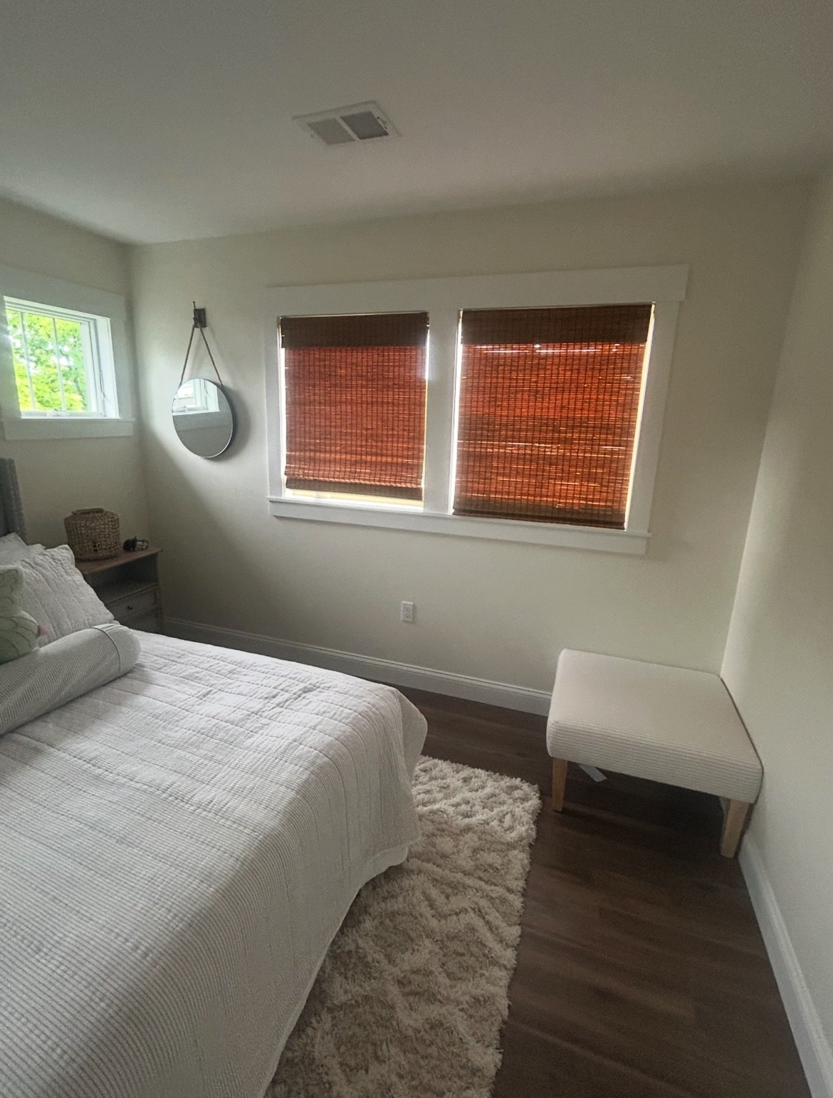 One of our bedrooms at the lake house… I have my bamboo shades closed here for privacy on the front windows. They are one of our favorite vines ever. Also love the rope round mirrors.

#LTKHome #LTKFamily #LTKStyleTip