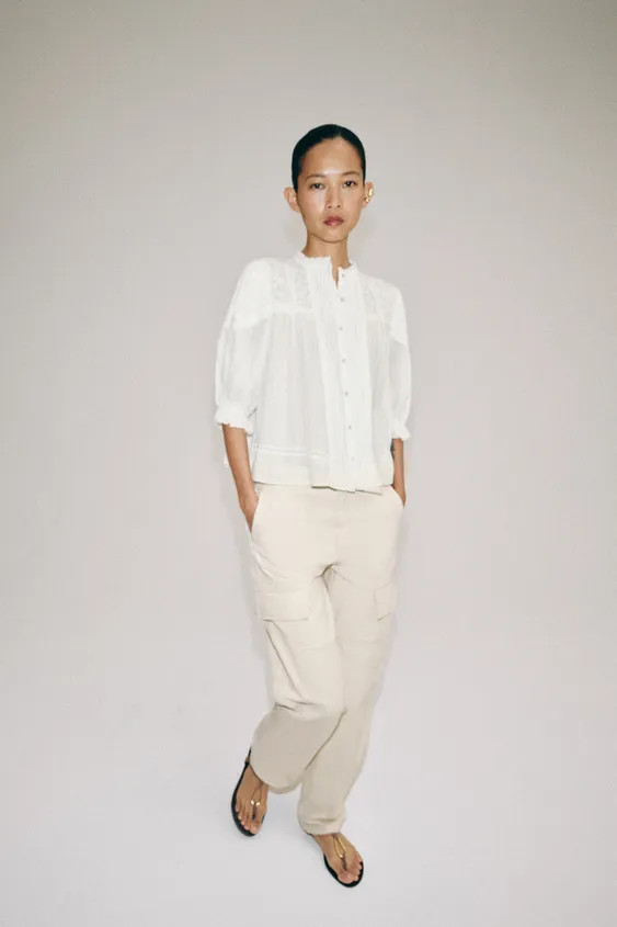 ZARA WOMAN COLLECTIONShirt made of cotton yarn. Round neck and puffed sleeves below the elbow. To... | Zara US
