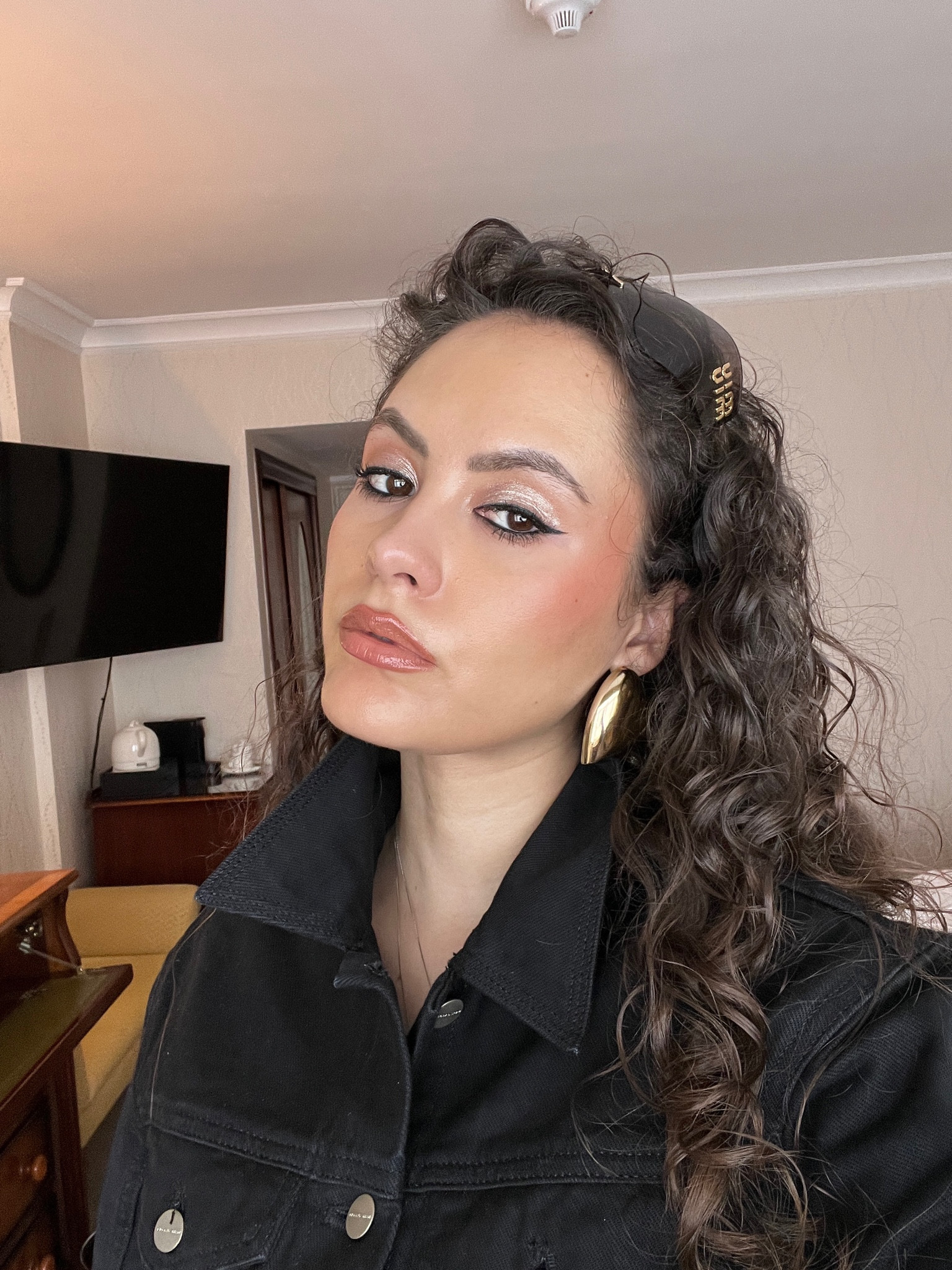 Black sunglasses, aviators, blush, liquid liner, gold earrings, black denim jacket 

#LTKSeasonal #LTKeurope #LTKbeauty