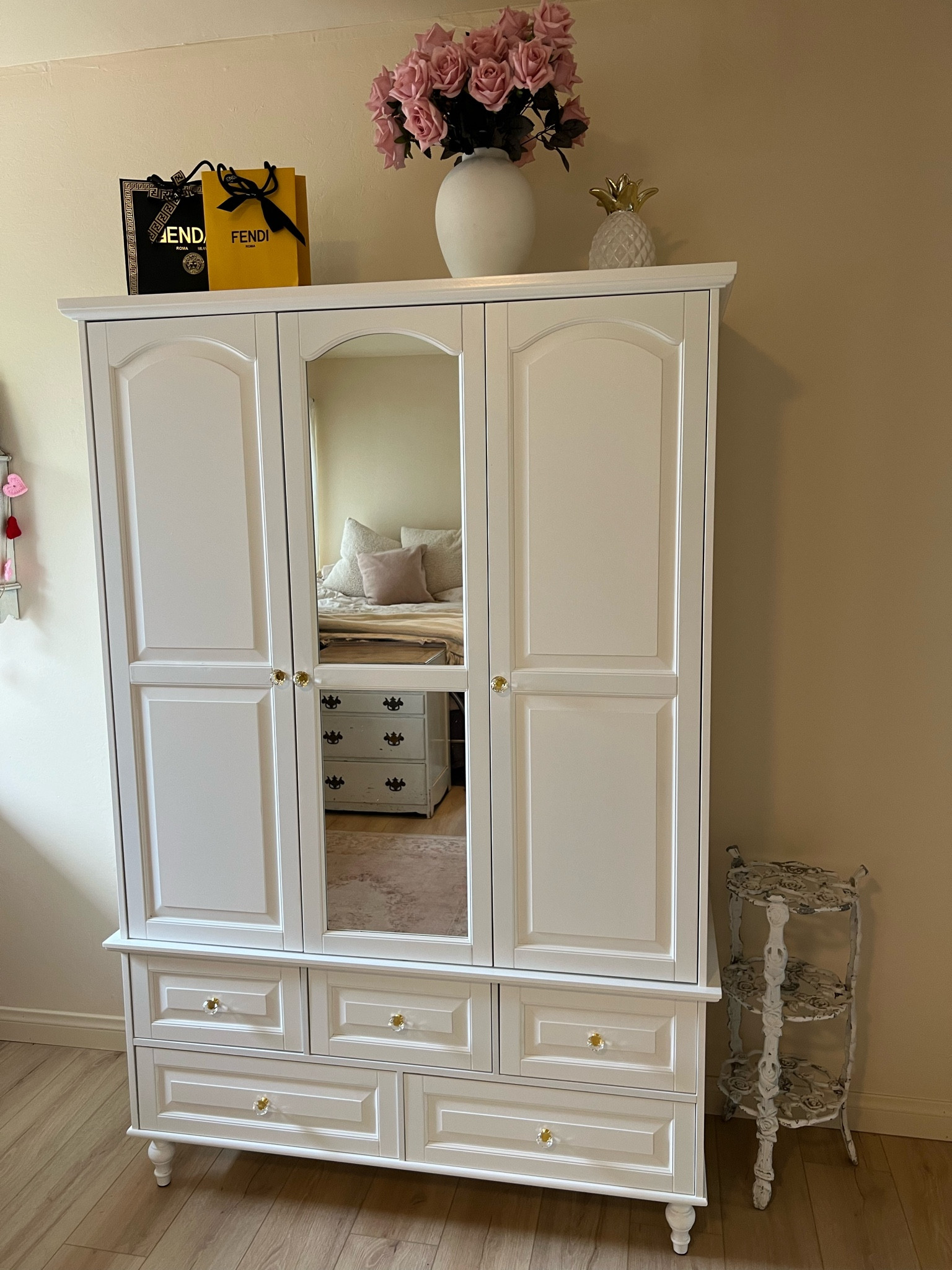 Pretty wardrobe from Wayfair 
Took about 5 hours and 2 people to assemble but she’s a pretty piece! 
Knobs are from Walmart to add a little something extra. Used screws provided with the wardrobe  

#LTKHome