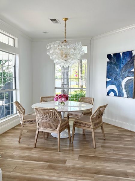 This dining room is the perfect casual eating space in our Lake House

Lakehouse dining room
Sand rope chairs 
White Sarnen style dining table 
Glass bubble chandelier 

#LTKSeasonal #LTKfamily #LTKhome