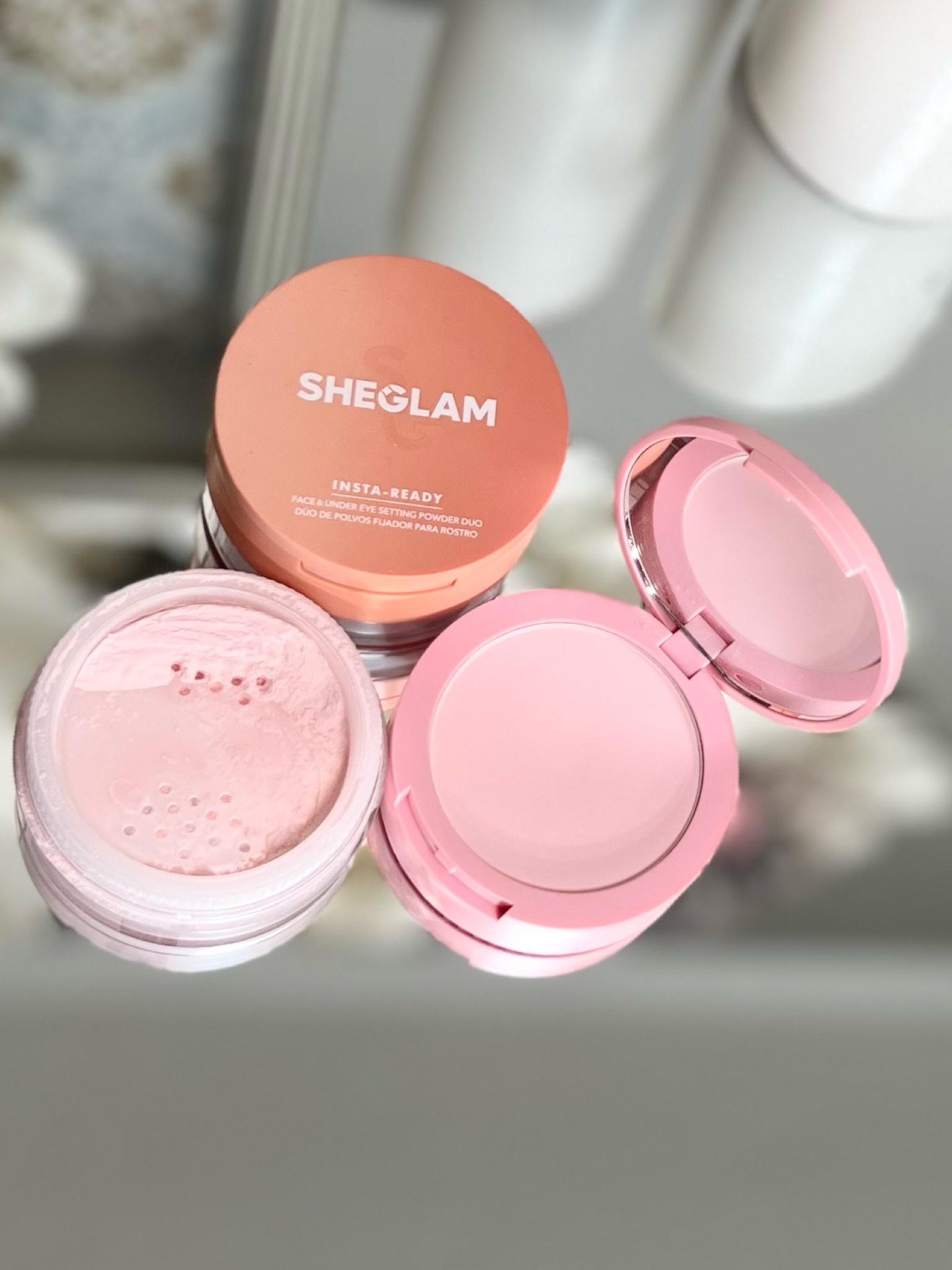 SHEGLAM Insta-Ready Face Powder Loose Under Eye Setting Powder.  2-in-1 setting powder is a great add to your beauty routine. On the top level you'll find a silky moisturizing pressed powder that's uniquely made to lock in your under eye makeup (and fill in any wrinkles), and on the bottom level, a sheer, oil-absorbing loose powder to keep your face fresh and shine-free!  I use the Bubble Gum color in areas that I want to brighten (under eyes, bridge of nose, chin + middle of forehead. .  And the translucent one everywhere else.  

* please note- Talc is a main ingredient in this product, so if you’re striving to be talc free, this product isn’t for you. 

#LTKwedding #LTKbeauty #LTKstyletip