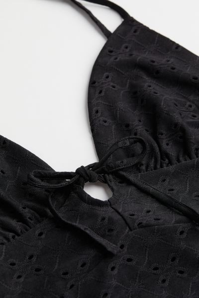 Short, V-neck dress in jersey with eyelet embroidery. Narrow, tie-top shoulder straps and ties at... | H&M (US + CA)