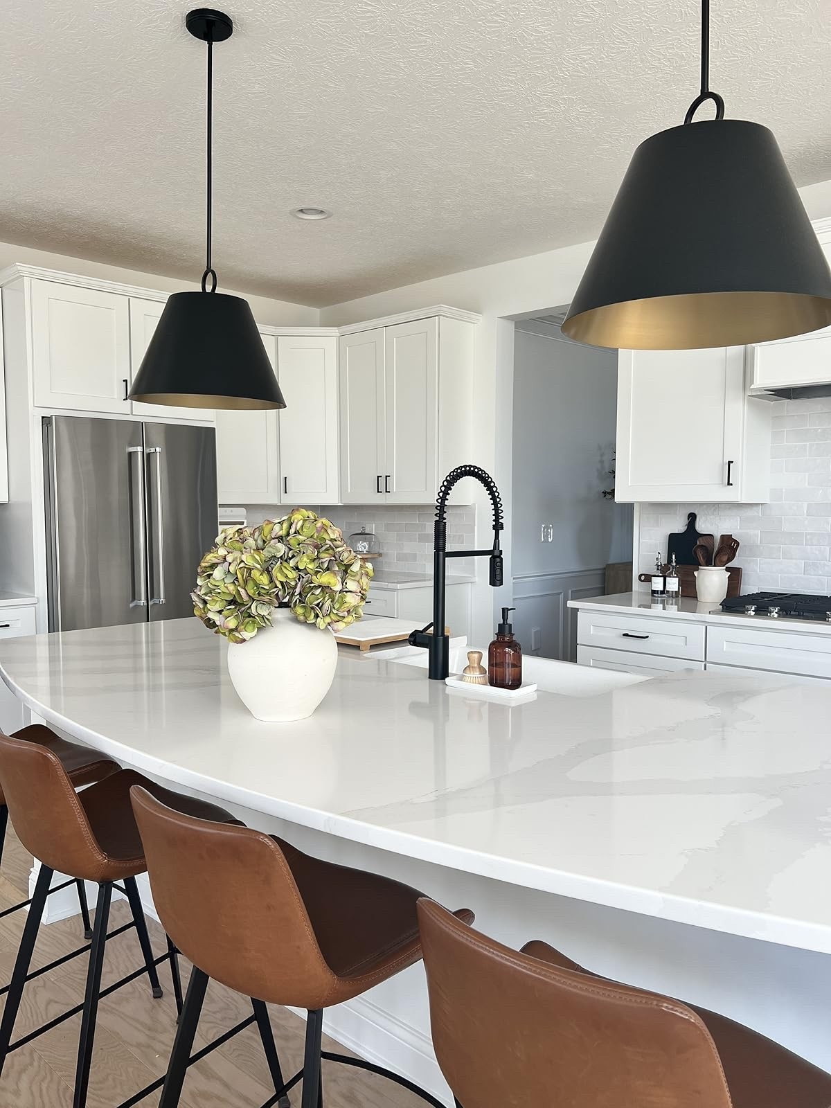 Upgrade your kitchen with these chic bar stools and elegant pendant lights. Perfect for a stylish kitchen vibe. #kitchendecor #AmazonFinds

#LTKHome