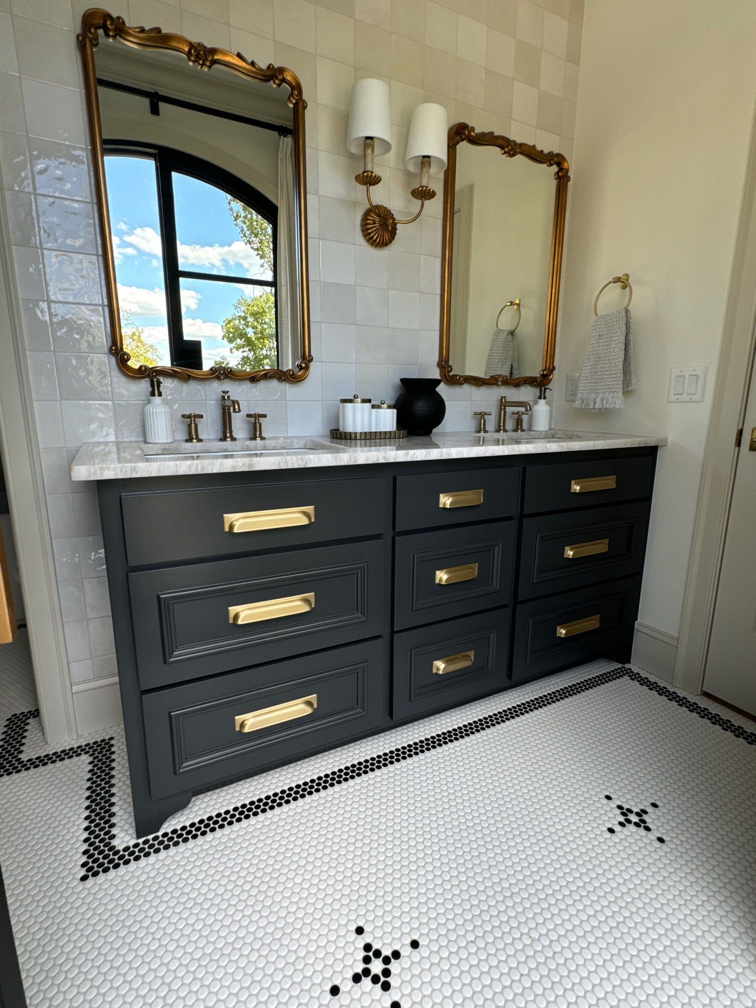 Bathroom lighting / sconce / brass sconce/ brass mirror / vanity mirror / bathroom mirror / wall mirror / bathroom  decor / black vase / milk glass / vintage look / target bathroom 

#LTKFindsUnder50 #LTKSaleAlert #LTKHome