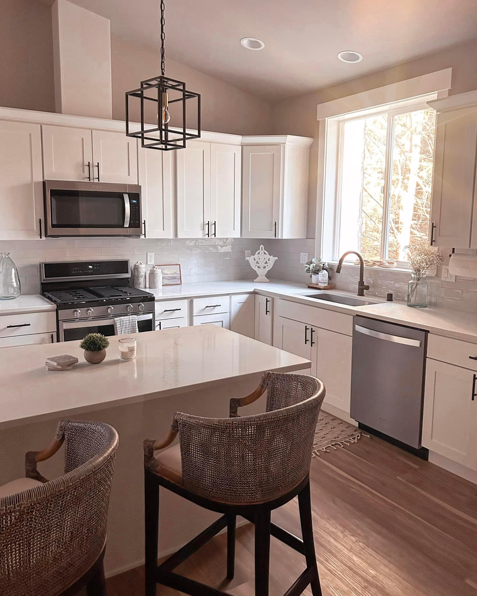Our new home 🏡 Still in shock we get to call this home ours. We are still getting things decorated and settled in! Here is a current pic of our kitchen, trying to keep it modern, yet cozy with a little bit of a beach touch. These counter stools from QVC are my fav. #LTKunder100

#LTKhome #LTKsalealert