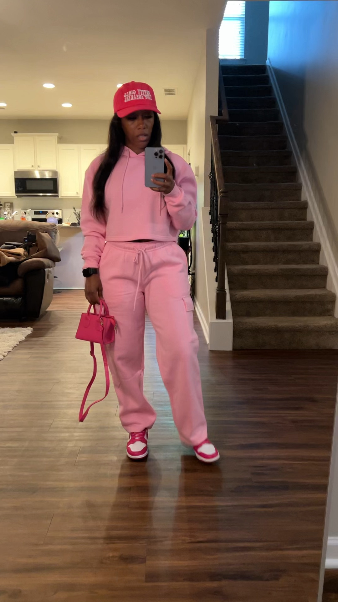 Pink cropped hoodie and pink cargo sweatpants styled with a pink baseball hat, pink purse, and pink and white sneakers

#LTKStyleTip #LTKSeasonal #LTKFindsUnder100