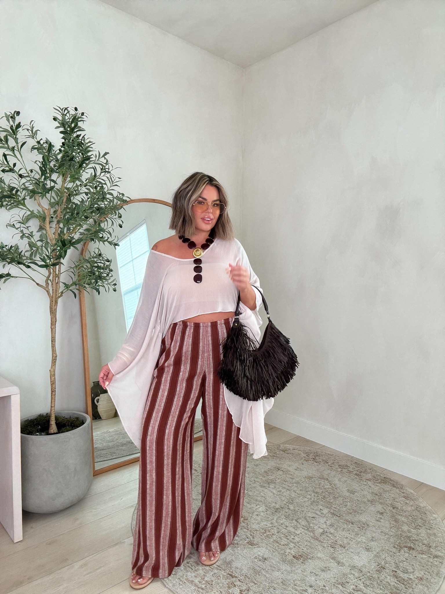 Top xl - I cut the little necklace thing off I didn’t like it. 
Pants size L - tall girl friendly for sure. I’m wearing a wedge and they are still long. I’m 5’5 for reference. 
Bandeau bra XL 
Bag and necklace are sold out so I also linked similar options for those.