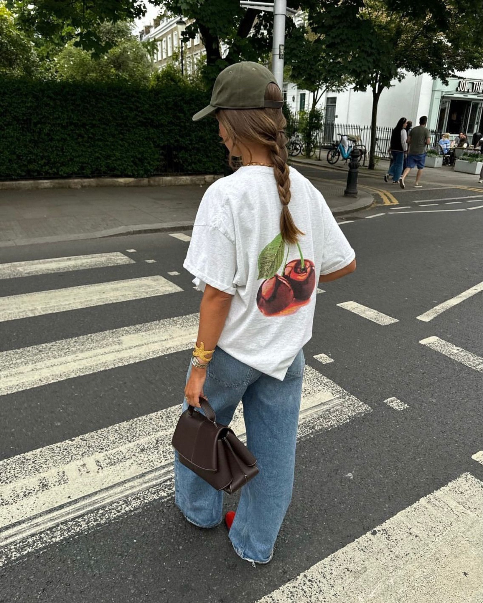 Anthropologie oversized graphic t-shirt, graphic tee, London fashion, casual outfit, aglode baggy jeans, wide leg denim, red ballet flats, brown handbag, statement jewellery, starfish, Brandy Melville baseball hat, khaki cap, rainy day outfit, capsule wardrobe 

#LTKeurope #LTKuk #LTKsummer