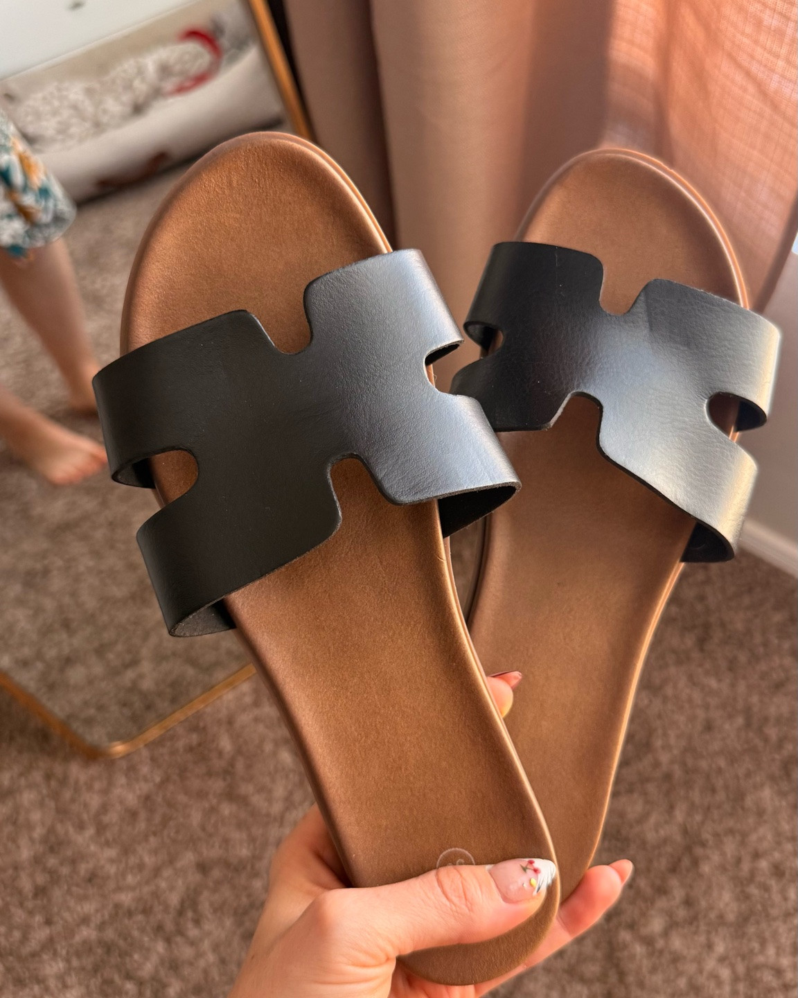 Black and brown casual yet simple and elegant sandals that will match everything in your closet for summer. Size down half a size, roomie strap as well not tight at all. ￼

#LTKSeasonal #LTKmomlife #LTKootd