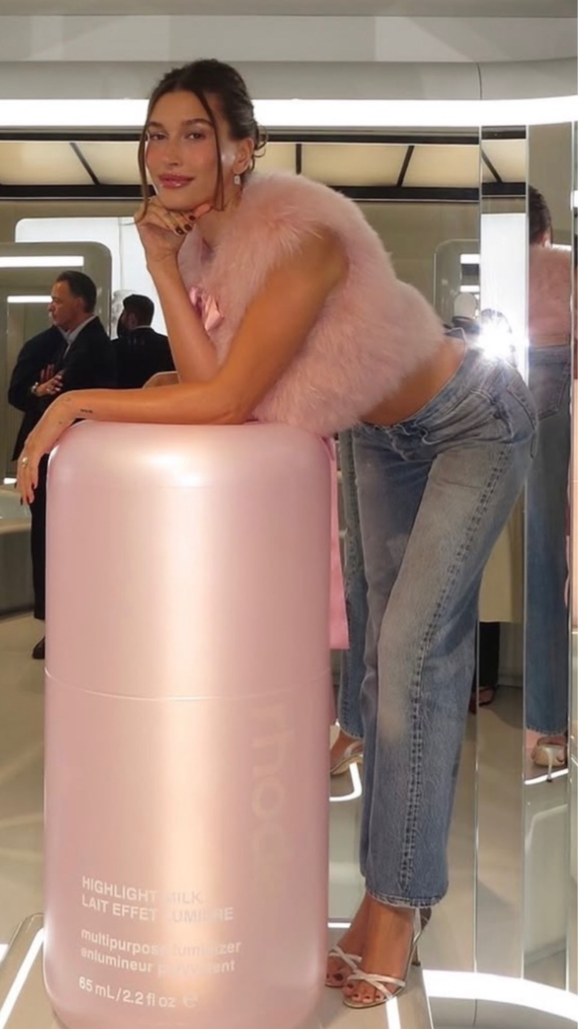 Hailey Bieber wearing Levi's 501 jeans silver shoes and pink fur vest ￼￼