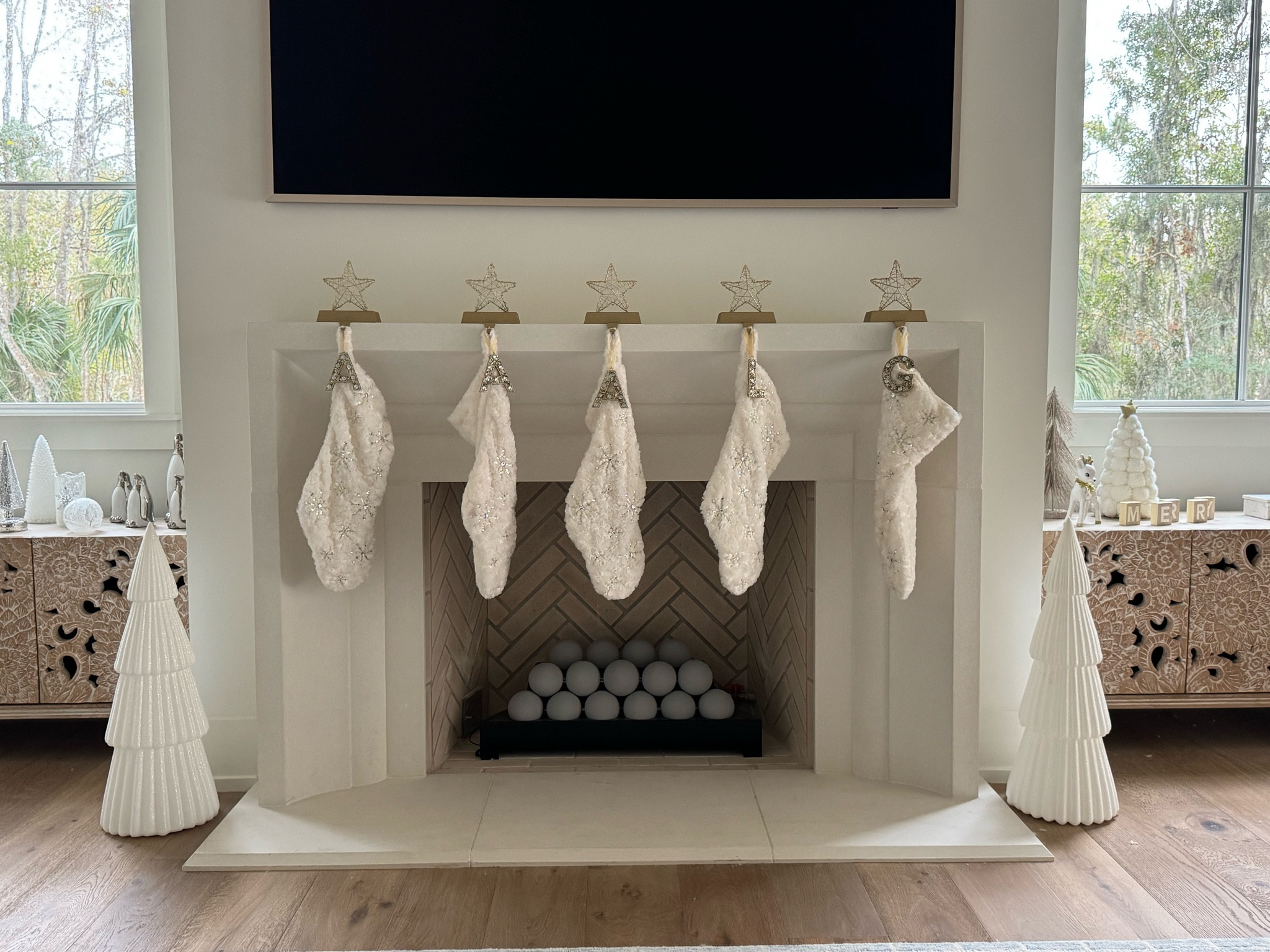 The stocking holders are target last season - but they have them again this year!  Stockings are old pier one but would love tips on them hanging straight if you have them.  My new add this year is the adorable wondershop glittered Christmas trees from Target - they are so cute and come in white and green online - other colors in store 🎄

#LTKHoliday #LTKHome #LTKOver40