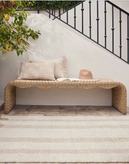 We love the chic, modern look the scalloped apron gives this indoor/outdoor bench. The backless design is perfect for a sunroom or deck, offering seating and sophistication with a warm, natural finish. Its all-weather wicker seat is comfortable and inviting while offering durability on your patio or porch.

#LTKover40 #LTKhome #LTKSeasonal