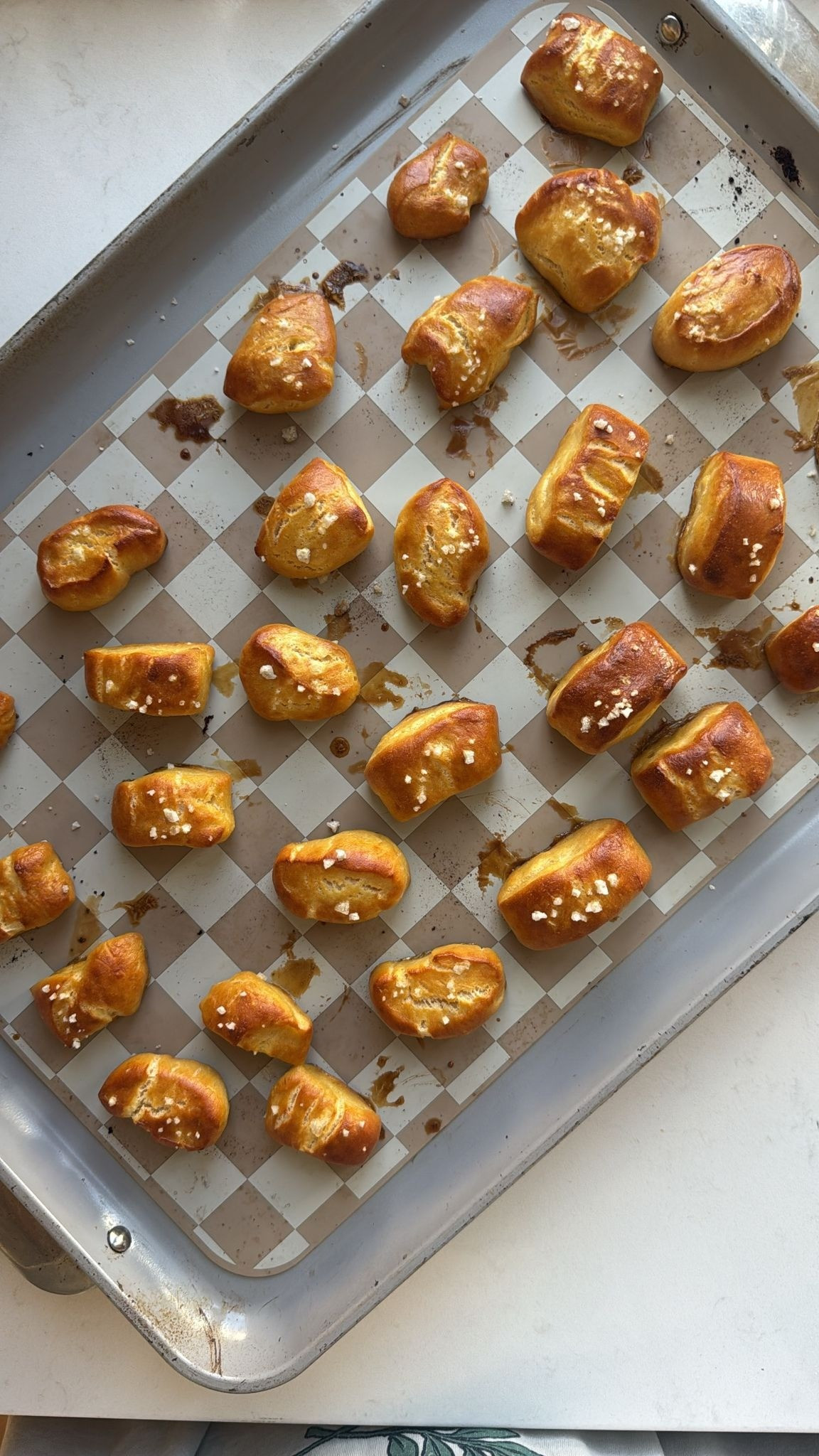 Baking our favorite pretzel bites on my favorite baking sheet. This recipe is so easy my daughter made it all by herself.  The recipe is from https://flavorfulpinch.com 

 #LTKmomlife #LTKfoodie
