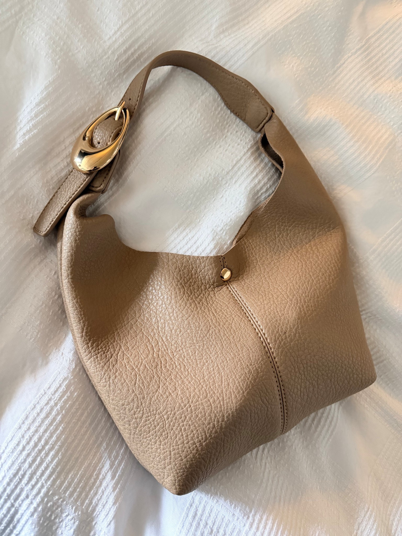 The most perfect sized bag for concerts or sporting events! Soft leather, chic structure & the gold buckle just takes it to the next level! So many color options- easy to travel with also! // Shop this bag below! 

#LTKFindsUnder100 #LTKSeasonal #LTKootd