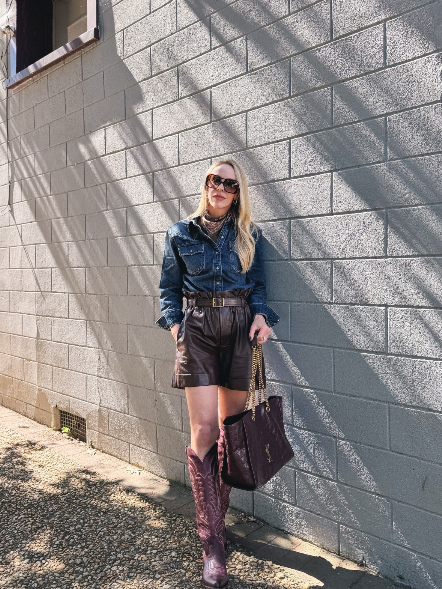 Western fall outfit with denim shirt, silk paisley scarf, leather shorts, burgundy @Tecovas cowboy boots

#LTKSeasonal #LTKOver40 #LTKSaleAlert