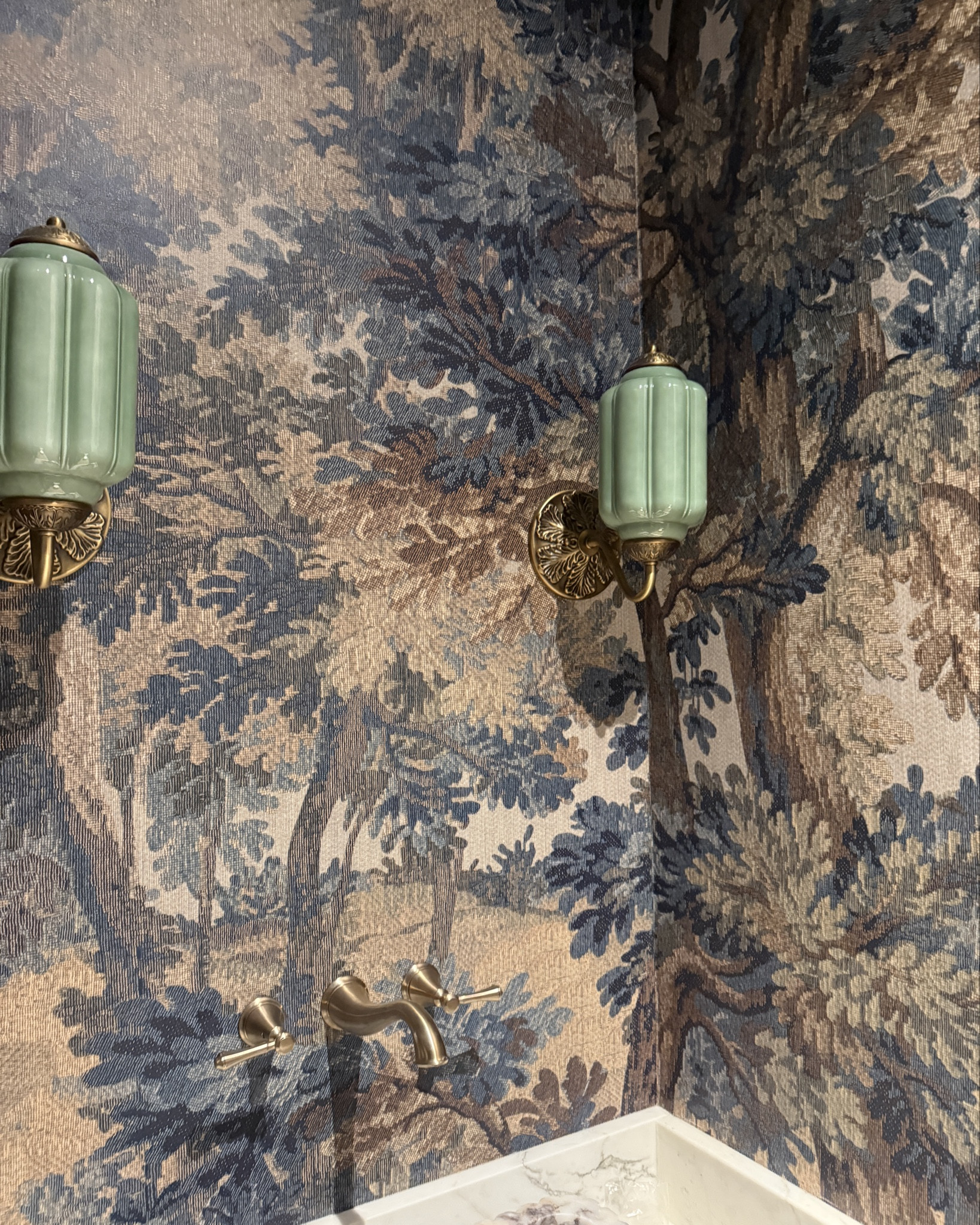 Moody powder room! Belarte studio landscape tapestry wallpaper in teal. 
Milk glass sconces | wall mounted faucet | calcatta viola marble sink | fluted sink| 
Home decor - interior design- wallpaper- Amazon- Lowe’s - Home Depot- cabinet hardware- delta faucet- champagne bronze- gold - delta showerhead- Anthropologie- light fixtures- sconces- cabinet knobs- cabinet handles- laundry room- kitchen- bathroom- Amazon finds- prime day- belarte studio- landscape mural- marble sink- wall mount faucet- delta kitchen faucet- prep sink faucet- pantry- kids bathroom- home design- new build- building- house build- remodel- Menards- fergusons- Etsy- wall color- alabaster- accessible beige- sherwin Williams- sconces- lights- home- construction- curated by stevi 

#LTKvlog #LTKHome