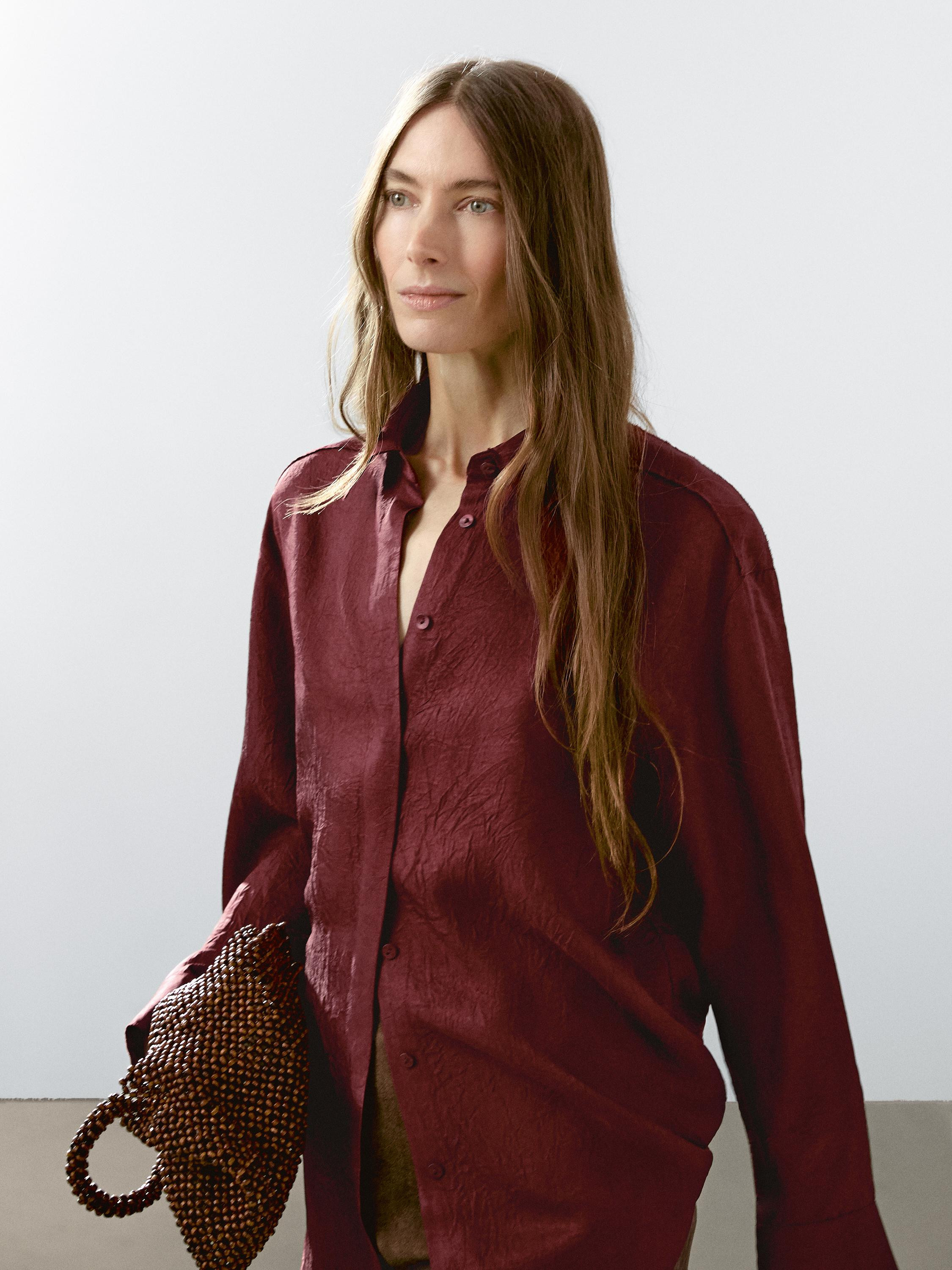 Long sleeves with buttoned cuffs. Oxford collar. Button and hidden buttoned strap fastening . Fra... | Massimo Dutti UK