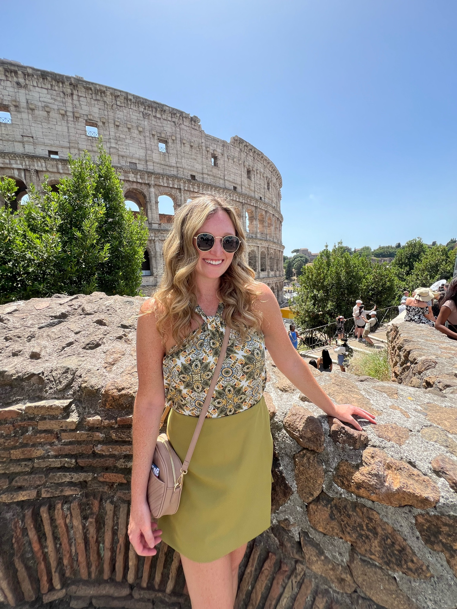 Realistic, affordable Europe summer vacation outfit. Printed green twist halter top, green skort, white comfort sneakers, beige quilted crossbody travel bag 

#LTKFindsUnder50 #LTKSummerSales #LTKTravel