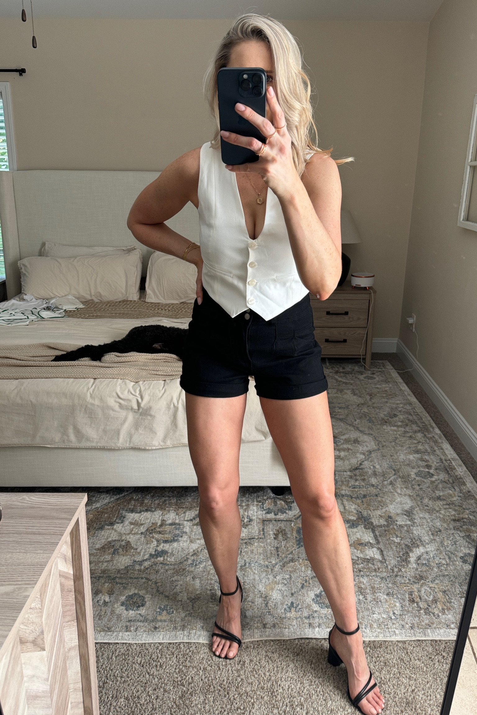 White vest, black shorts, black heels 

#LTKFindsUnder50 #LTKShoeCrush