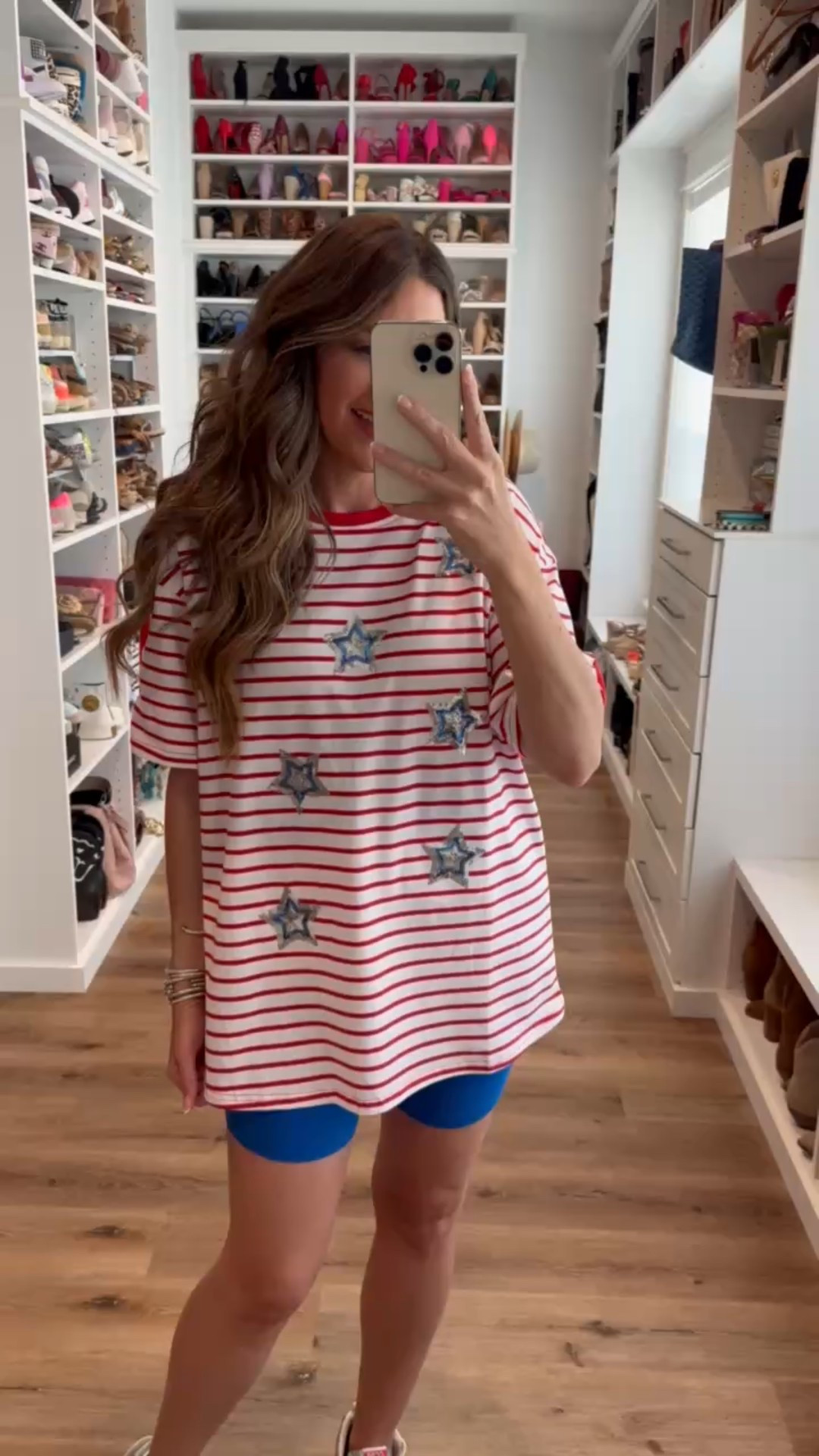 In a large sequin star stripe tee, small biker shorts, sneakers and accessories for patriotic look- fits tts.

#LTKStyleTip #LTKSeasonal #LTKFindsUnder50