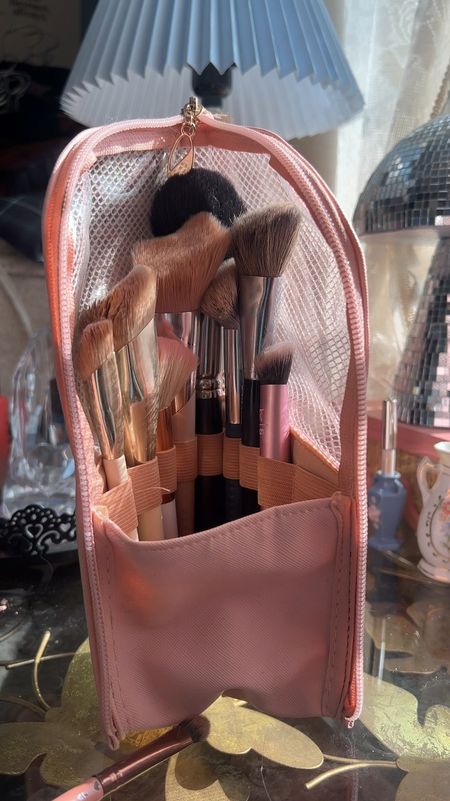 I use this traveling makeup brush holder for vacations but I also use it for extra brush storage when I’m at home. Makeup brushes start to accumulate lol but the thing I love the most about it is it stays standing up. So you can just place it on the bathroom counter or desk at a hotel and your brushes are all right there organized and ready to use. 

#LTKbeauty #LTKfindsunder50 #LTKtravel