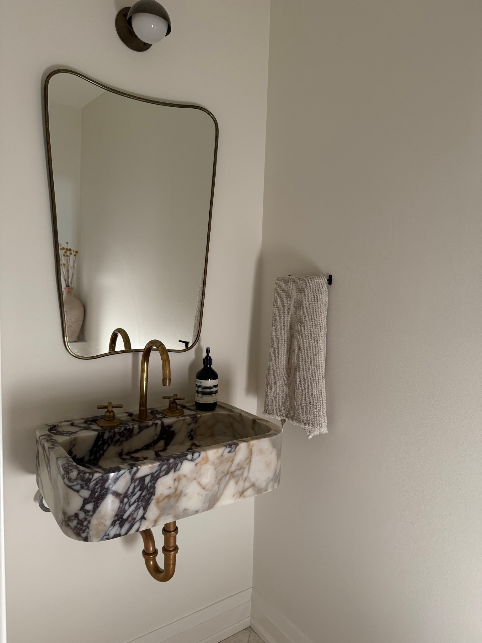 Powder room Bathroom links. Calacutta marble sink made in Turkey, vintage brass sconce and mirror 🫶🏻

#LTKcanada #LTKcasa
