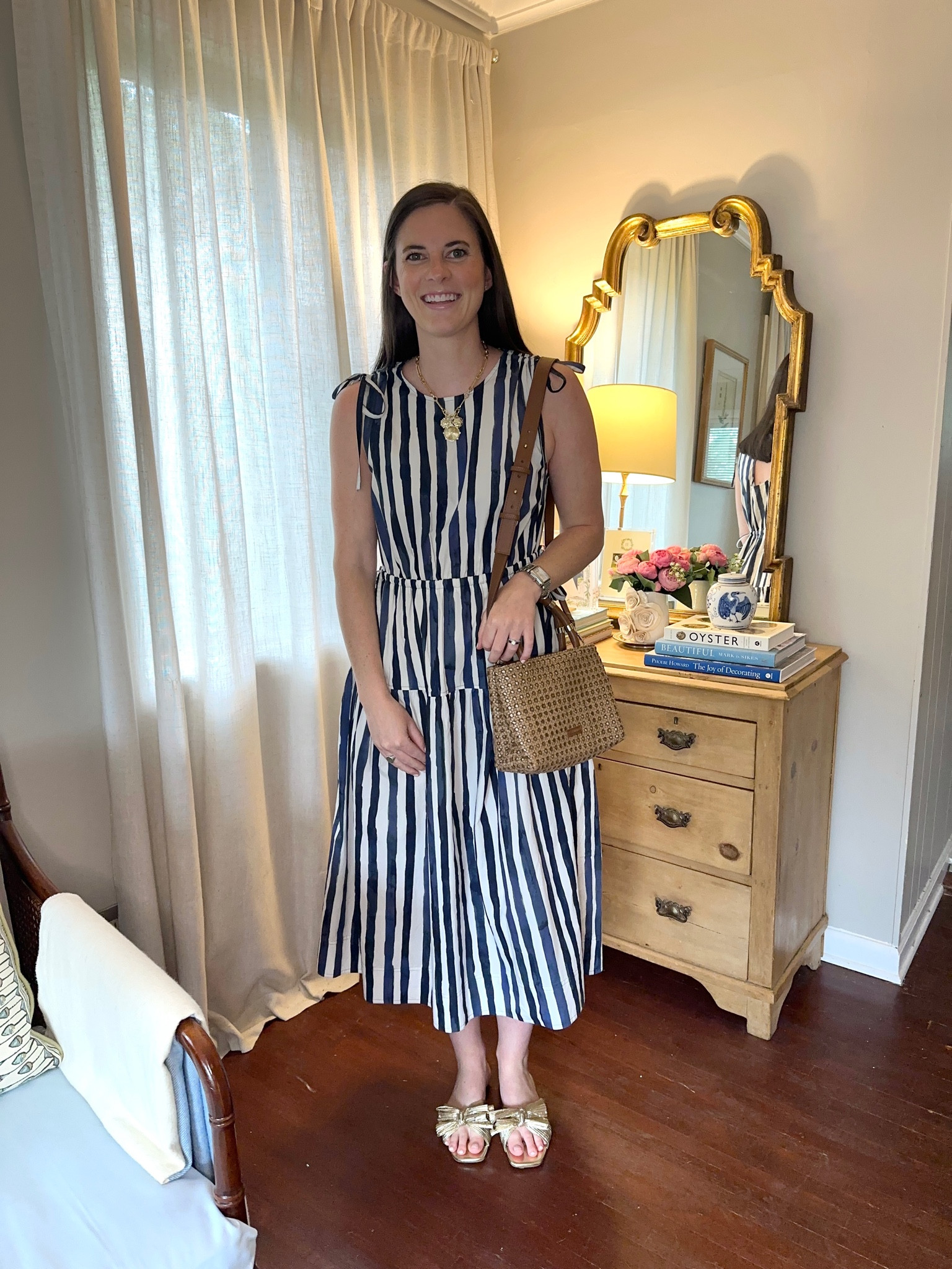 Fourth of July Outfit Inspiration. Adorable navy and white stripe Marie Oliver dress with tie details (I’m in a size small), J. Lowery Cane William Bag, gold bow sandals, and Amazon necklace  

#LTKFindsUnder50 #LTKFindsUnder100